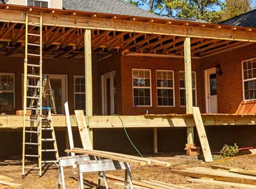 Men installing a new roof on a house.